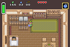 Link in a house with a Mario portrait in the original version (left) and the Game Boy Advance port (right).